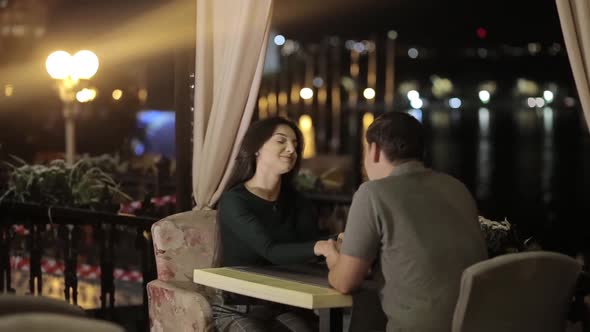 A Romantic Couple Having Fun in a Cafe in Love with Valentine's Day