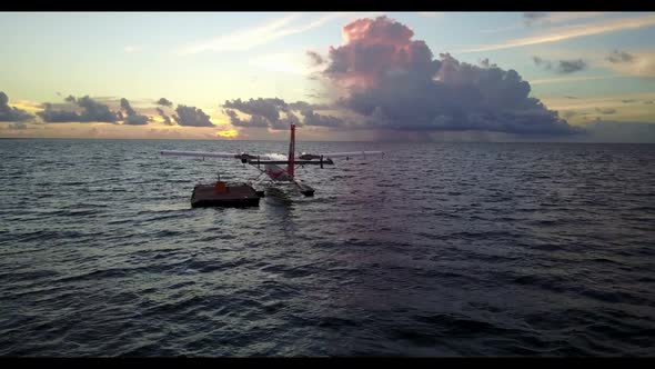 Aerial drone view seascape of beautiful lagoon beach voyage by blue sea with white sandy background 