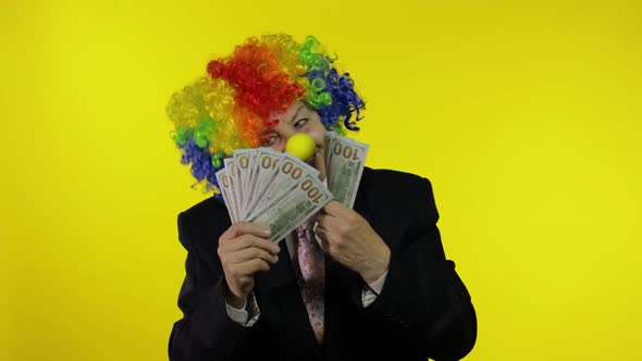 Elderly Clown Businesswoman Freelancer Boss Dancing with Money Cash Banknotes