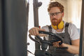 Professional forklift driver in working in wood warehouse and loading wooden board - PhotoDune Item for Sale