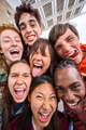 Vertical funny selfie of multiracial group young students together outdoors. Excited comic people.  - PhotoDune Item for Sale