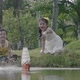Asian Children Launching Their Toy Sailboat - VideoHive Item for Sale