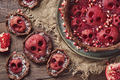 Halloween food. Homemade pie and tartlets with jam and scary skull-shaped pears. - PhotoDune Item for Sale