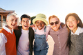Portrait of multiracial group of students having fun hugging laugh a lot. They laugh outdoors - PhotoDune Item for Sale