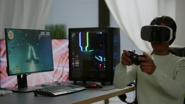 Black Videogamer Woman Winning Space Shooter Game Using Virtual Reality