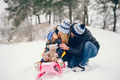 Little girl with parents playing in a winter park - PhotoDune Item for Sale