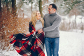 Beutiful woman in a winter park with her husband - PhotoDune Item for Sale