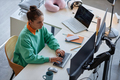 Woman working with computers at her workplace - PhotoDune Item for Sale