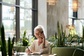 Senior woman having conversation on mobile phone - PhotoDune Item for Sale