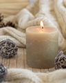 Burning candle near natural wooden decorations, Close up. Bohemian or scandinavian styled home - PhotoDune Item for Sale