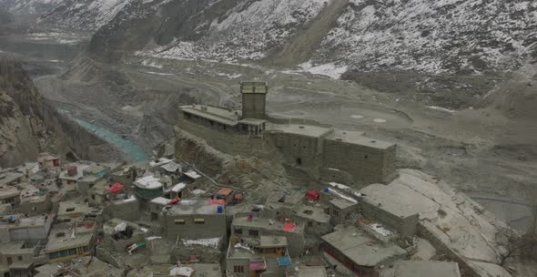 Aerial Flying Over Remote Hillside Village In Hunza Valley In Pakistan. Dolly Forward