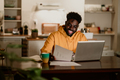 African american entrepreneur is sitting at home and working - PhotoDune Item for Sale