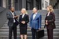 Business people standing and talk to each other in front of modern office - PhotoDune Item for Sale