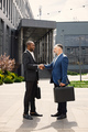 Business people standing and talk to each other in front of modern office - PhotoDune Item for Sale