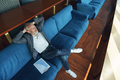Senior businessman relaxing on sofa after working day and looking at side - PhotoDune Item for Sale
