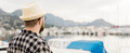 Banner rear view millennial man wearing hat with yachts and marina background with copy space and - PhotoDune Item for Sale