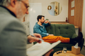 A worried patient is sitting on the therapist's couch - PhotoDune Item for Sale