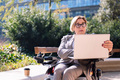 businesswoman using wheelchair working with laptop - PhotoDune Item for Sale