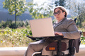 businesswoman using wheelchair work with computer - PhotoDune Item for Sale