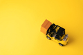 The yellow forklift is busy transporting goods.  - PhotoDune Item for Sale