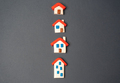 Houses figurines in a row. Find most suitable housing options.  - PhotoDune Item for Sale