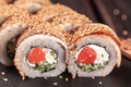 Sushi roll with smoked eel and salmon with cucumber and cheese close-up. Traditional delicious fresh - PhotoDune Item for Sale
