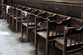 Rows of old church pews. Interior of an ancient church. - PhotoDune Item for Sale