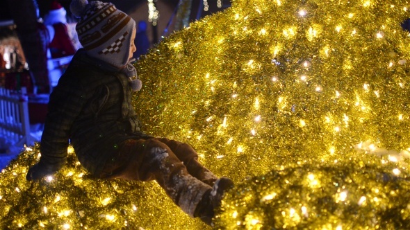 Kids Sitting In Decorated Lights 01