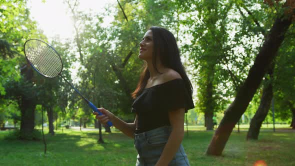 Girl playing badminton in a park