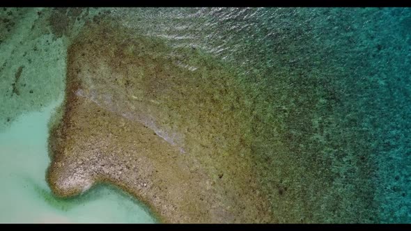 Aerial tourism of luxury seashore beach adventure by blue ocean with white sand background of a dayo