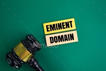 judge's gavel and colored paper with the words Eminent Domain