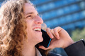 man laughing while talking by mobile phone - PhotoDune Item for Sale