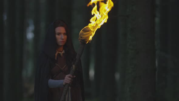 Woman holding a fire staff