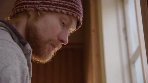 CLOSEUP handsome plasterers face as he works with the clay