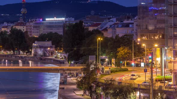 Aerial View Along the Danube Canal in Vienna Night to Day Timelapse Before Sunrise