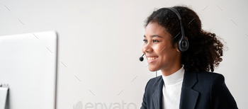 Female call center provides information to a customer calling for help, Contact us