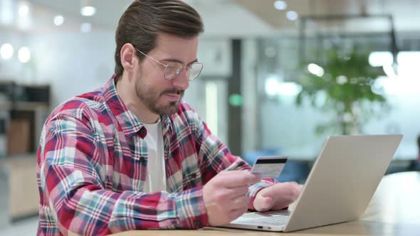 Man Making Online Payment on Laptop