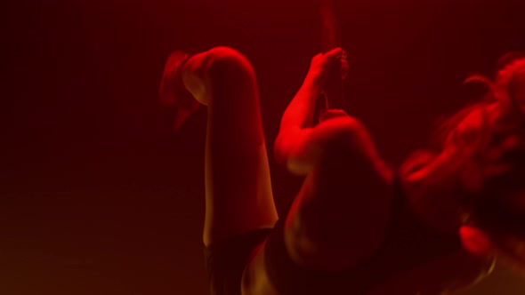 Gorgeous Lady Making Twine Performing Poledance in Club