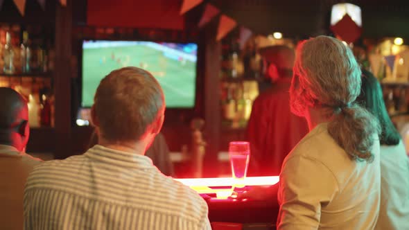 People Watching Football Match