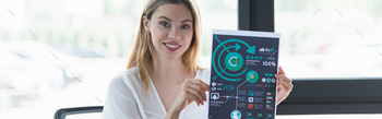 Positive businesswoman showing paper with graphs in office, banner