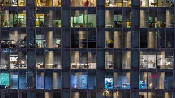 Night Aerial View of Office or Apartment Building Glass Window Facade with Illuminated Lighted