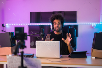 Influencer recording a video tutorial in a music studio