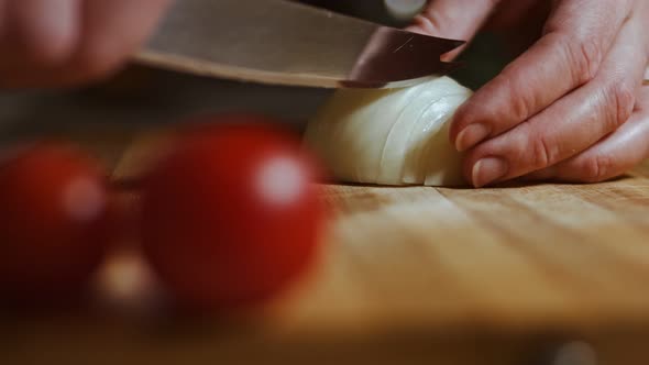 Chopping Onions Chef on a Wooden Board