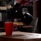 Cinematic Slow Motion Pouring Coffee in Red Mug from Black Mokapot - VideoHive Item for Sale