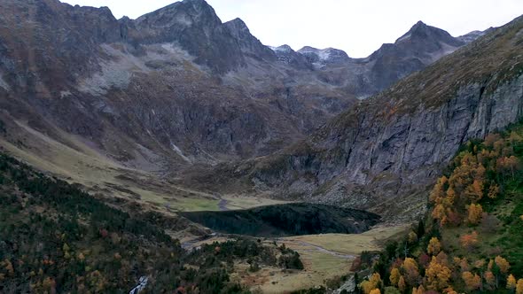 Lac d'Espingo lake panoramic view in Haute-Garonne, Pyrénées mountains, France, Aerial approach reve