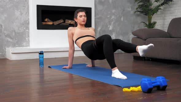 Fit Woman in Sportswear Does Sports Training Workout on Fitness Yoga Mat at Home