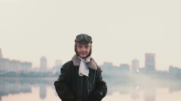 Portrait of Little Girl in Old Pilot Costume on Sunset