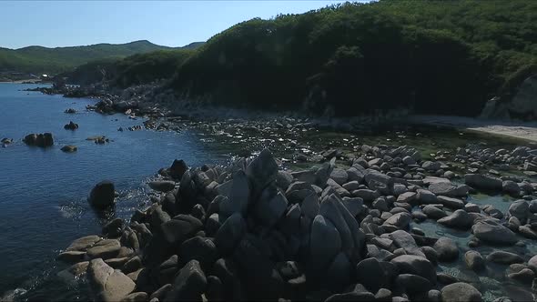 Aerial Shot of Coastline Bay with the Rocks and Cliffs