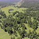 Green Meadows in The Sparsely Wooded Between Forest Covered Hills with Aerial View - VideoHive Item for Sale