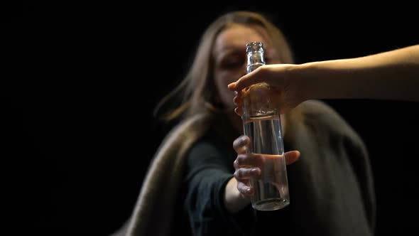 Alcoholic Female Greedily Drinking Vodka From Bottle, Miserable Life, Disgust